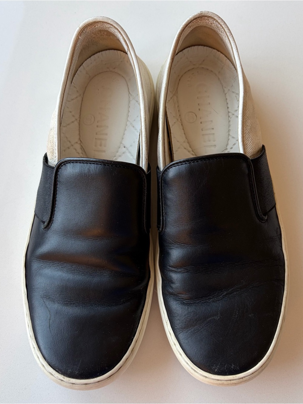 Chanel Women’s Slip-On Leather Sneakers in Black and Cream Size 36